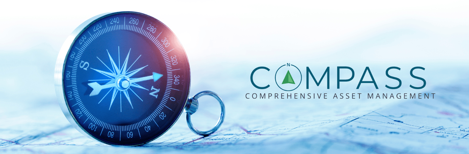 COMPASS Comprehensive Asset Management logo beside a compass resting on a map